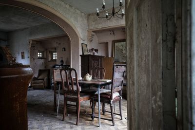 Empty chairs and tables in building