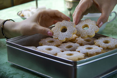 Close-up of hands holding cookies