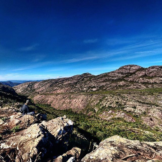 mountain, tranquil scene, tranquility, landscape, scenics, blue, mountain range, sky, beauty in nature, rock - object, nature, rock formation, non-urban scene, geology, physical geography, rock, remote, idyllic, rocky mountains, cloud