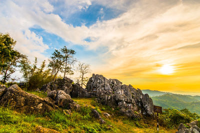 Scenic view of rocky mountains against sky during sunset