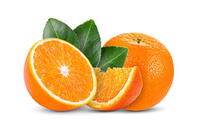Close-up of orange fruit against white background