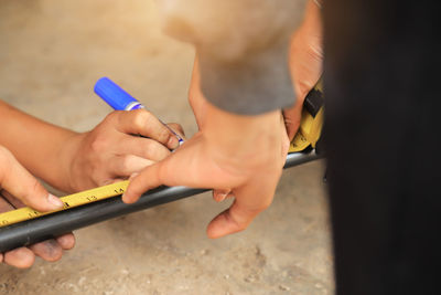 Close-up of man holding hands