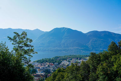 Scenic view of mountains against clear blue sky