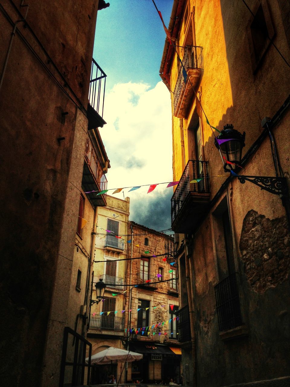 architecture, building exterior, built structure, residential building, residential structure, low angle view, building, sky, house, city, window, residential district, outdoors, old town, town, day, no people, city life, cloud, balcony