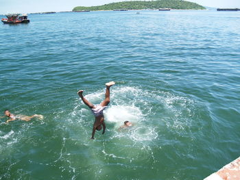 High angle view of man swimming in sea