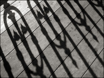 High angle view of shadow on footpath