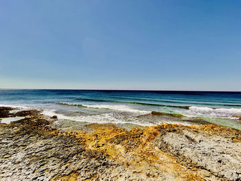 Scenic view of sea against clear sky