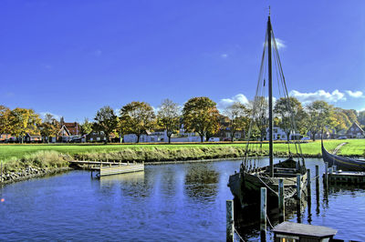 Scenic view of lake against clear blue sky