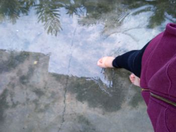 High angle view of woman standing by water