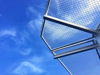 Low angle view of office building against blue sky