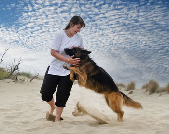 Full length of dog on beach