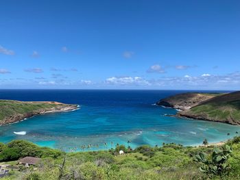 Scenic view of sea against blue sky