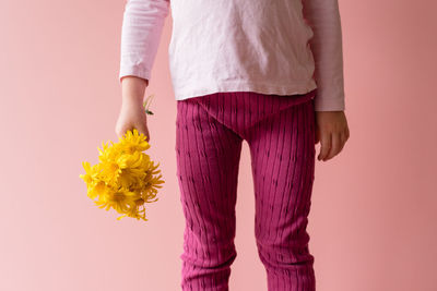 Close-up of young woman against white background