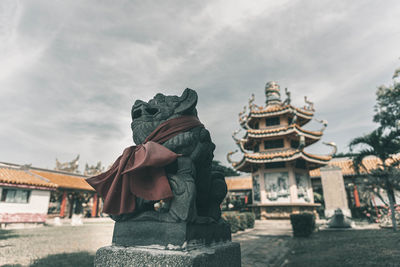 Statue of temple against sky