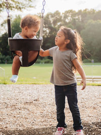 Full length of children playing on playground