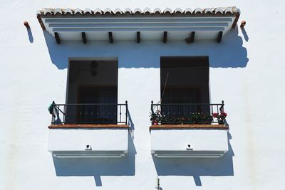 Low angle view of windows on house