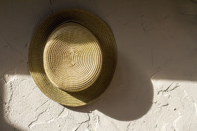 Close-up of hat hanging on wall
