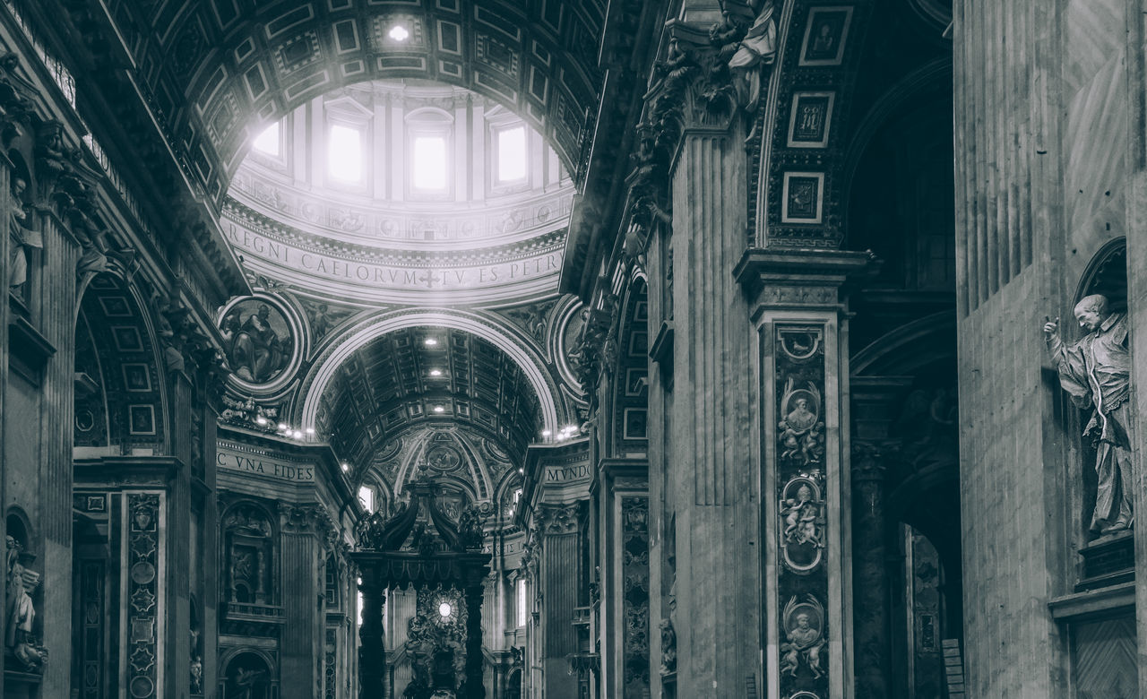 LOW ANGLE VIEW OF ILLUMINATED CEILING IN TEMPLE BUILDING