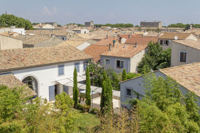 Buildings in town against sky