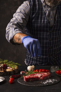 Midsection of man preparing food