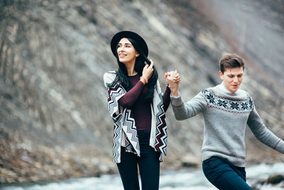 Young couple standing outdoors