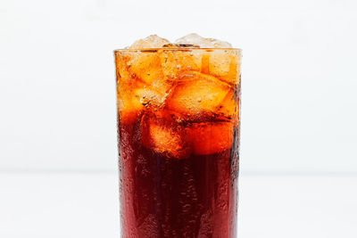 Close-up of drink against white background