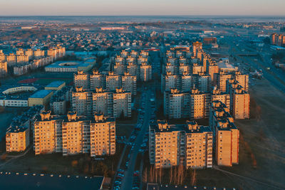 Aerial view of modern buildings at sunset