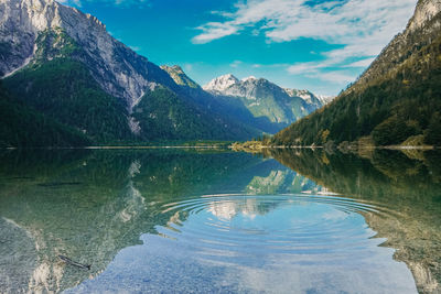 Scenic view of lake and mountains against sky