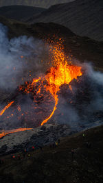 Smoke emitting from volcanic mountain at night