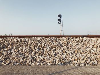 Railroad tracks against clear sky