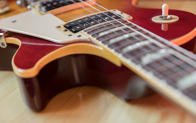 Close-up of guitar on table