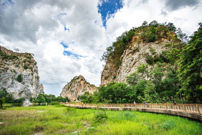 Panoramic view of rocks and trees against sky