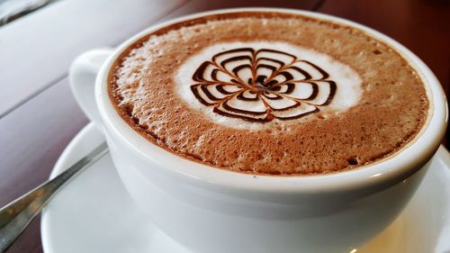 High angle view of cappuccino on table