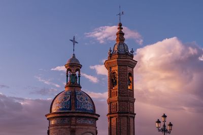 Low angle view of bell tower against sky