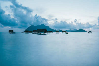 Scenic view of sea and buildings against sky