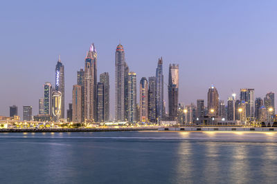 Amazing dubai marina and famous jumeirah beach at sunset, united arab emirates