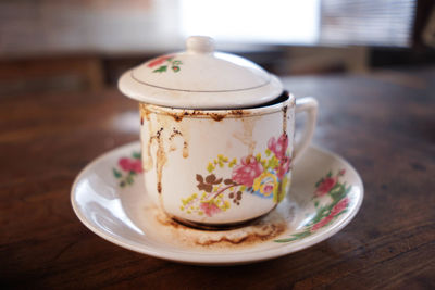 Close-up of coffee cup on table