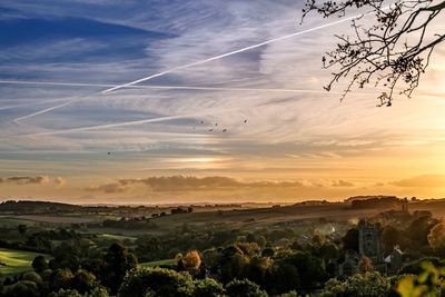 Scenic view of landscape against sky during sunset