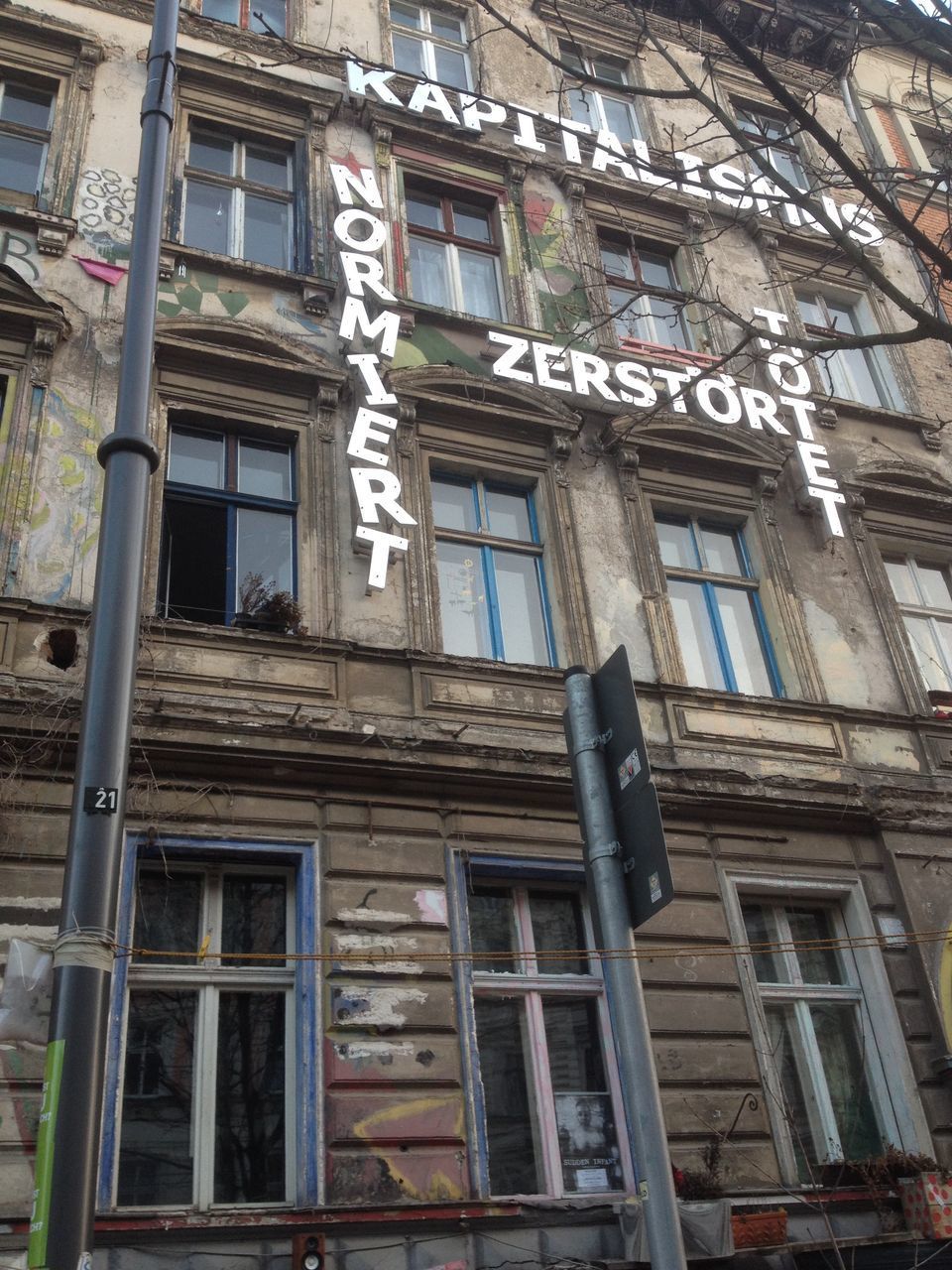 LOW ANGLE VIEW OF BUILDING WITH WINDOWS