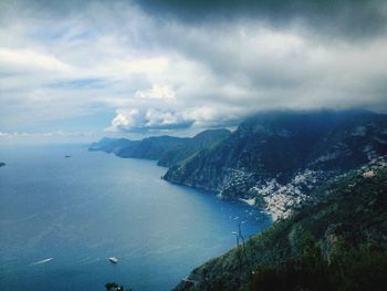 Scenic view of sea against cloudy sky