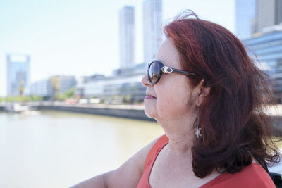 Portrait of young woman in city