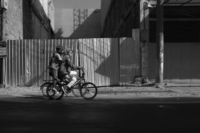 Man riding bicycle on road