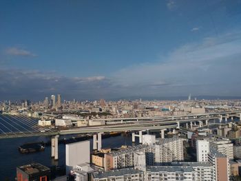 High angle view of buildings in city against sky