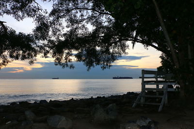 Scenic view of sea against sky at sunset