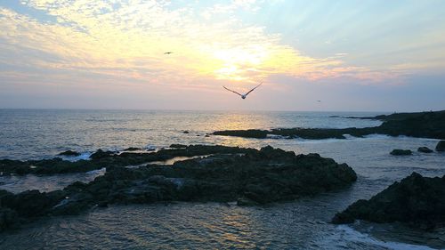 Scenic view of sea against sky during sunset