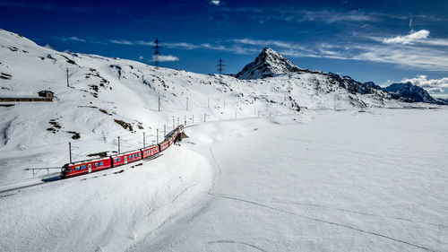 Scenic view of snow covered mountains against sky