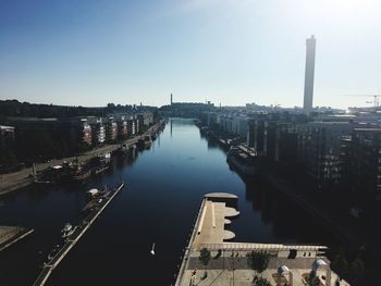 High angle view of river amidst buildings against sky