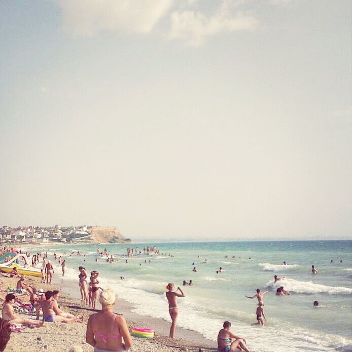 beach, large group of people, sea, shore, water, horizon over water, vacations, leisure activity, lifestyles, sand, mixed age range, person, enjoyment, sky, men, summer, enjoying, tourist, weekend activities