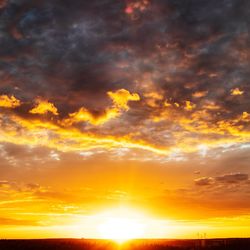 Low angle view of dramatic sky during sunset