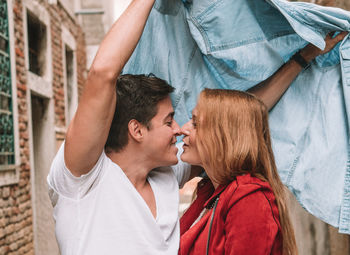 Portrait of couple kissing outdoors